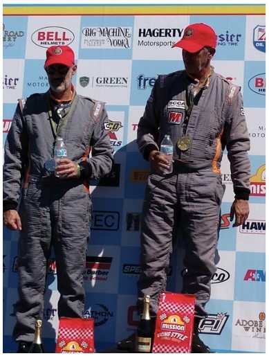 Sandy Wiggins celebrating a second place finish in a sports car race at Virginia International Raceway