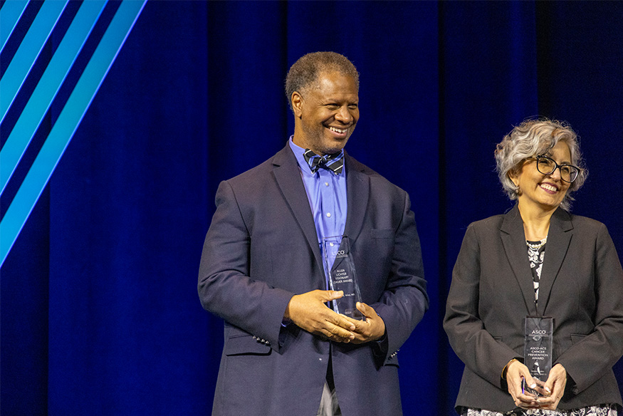 Group photo of Massey director Robert A. Winn, M.D. receiving the American Society of Cancer Oncology (ASCO) Allen Lichter Visionary Leader Award during the ASCO Annual Meeting in Chicago on June 1