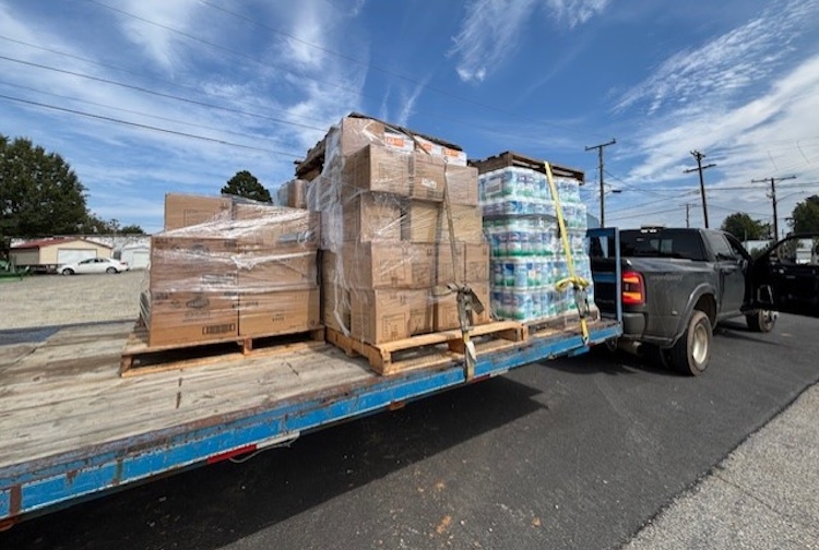 Flatbed truck with water and other donated items