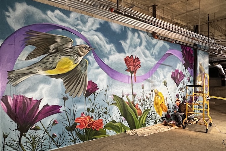 Mural on a wall in a parking garage.