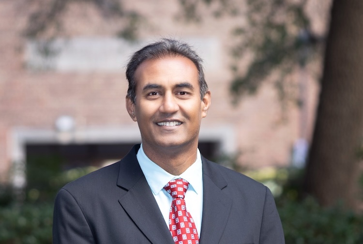 Vig Patel standing in garden