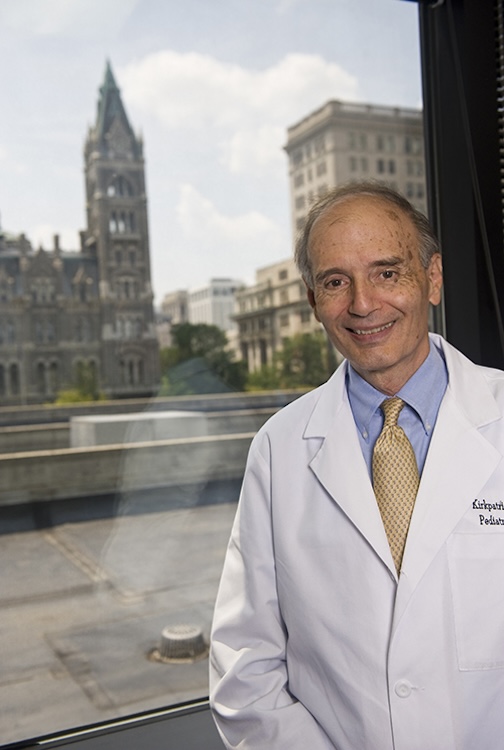 older doctor with a white coat