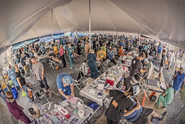 Missions of Mercy dental care event is set up in a large tent, this is before they moved to UVA Wise